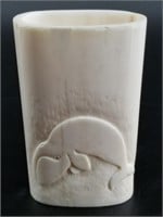 Relief carved walrus ivory cup and signed in good