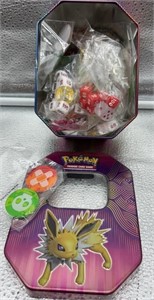 Pokémon tin with dice