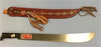Machete with a leather sheath that decorated with