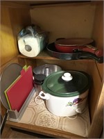 Cupboard full of miscellaneous pots crockpot