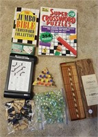 Games, crossword, cat eye marbles, chess pieces