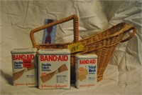 tin Band-Aid containers in basket