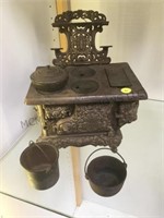 Royal toy cast iron stove w/ pans, antique