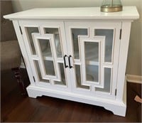White 2-Door Cabinet with Glass Cutout Designs on