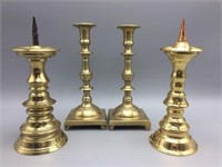 Four brass candlesticks