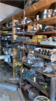 Wall of parts (on shelves and on floor directly