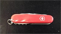 One red Swiss Army knife with 8 tools