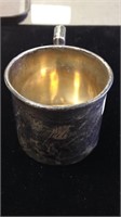 One hallmarked handled sterling silver baby cup