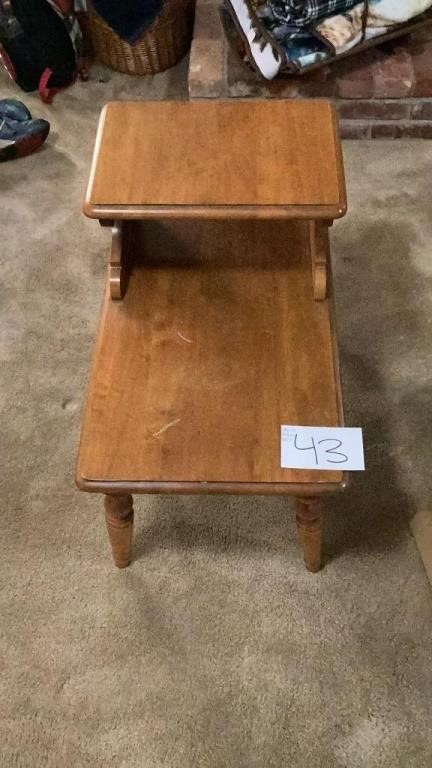 Wooden side table measures approximately 26