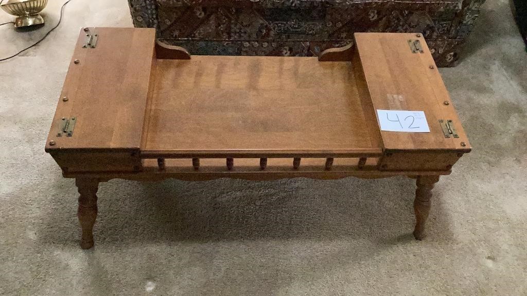 Wooden coffee table measures approximately 42