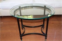 Glass top oval table on metal base 28" X 21" X