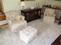 Pair of upholstered arm chairs with ottoman