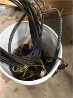 Bucket of wire and household extension cords