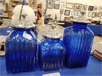 SET OF THREE COBALT BLUE LIDDED GLASS CANISTERS