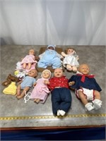 Assortment of baby dolls and some accessories