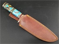 Fixed bladed knife with heavy brass guard and end