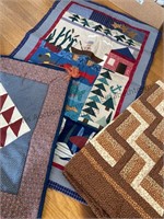 Quilted wall hangings and lap quilt, they look