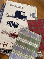 Box of placemats and blanket throws , table
