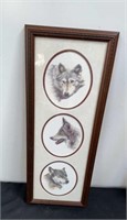 Framed wolf pictures, 25 X 9.5 inches.