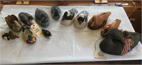 collection of ceramic and wooden ducks