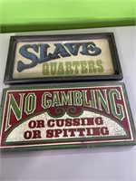 2 signs - slave quarters & no gambling - both
