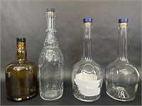 Four Decorative Empty Glass Bottles