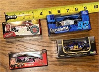 4 toy Race Cars