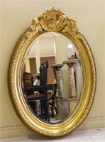 Oval Shell Crowned Gilt Framed Beveled Mirror.