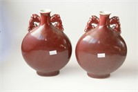 Pair of Chinese burgundy glazed moon flasks