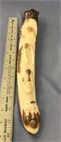 14" fossilized ivory tusk with relief carvings of