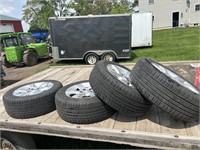 Four tires with rims: 215/60 R 16 - Nissan