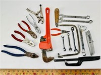 Pipe wrench, hand saw, pliers, BluePoint wrench,