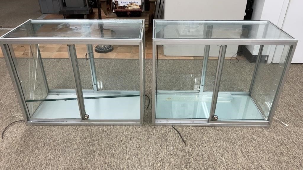 Two display cabinets with glass shelves and front