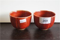 Pair of red glazed lobed wine cups with 6