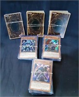 6 stacks of Konami Yu-Gu-Oh! Trading Cards seems