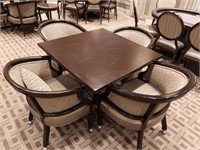 Table including 4 chairs with arms
