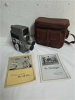 vintage Kodak camera with paperwork and case