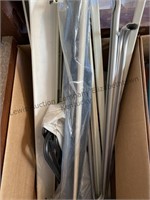 Box of assorted curtain rods
