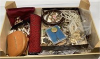 Box contains a variety of vintage necklaces,