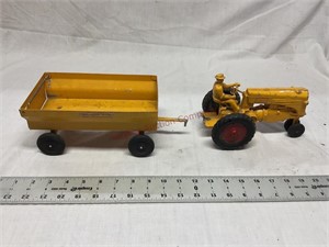 Vintage Minneapolis, Moline cast tractor with a