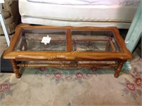 Glass top coffee table. 16"h x 51.5"h x 24"d