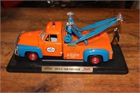 1953 Ford F150 wrecker toy on stand