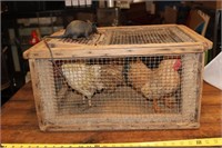 Vintage wooden chicken cage with faux chickens