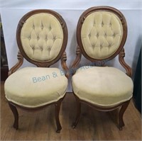 Carved green upholstered chairs