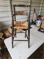 Antique high chair with stenciling
