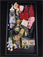 Small dolls and collectibles. Assorted. Cat Woman