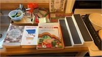 Spice rack, cook books, glass prep board, bake