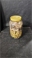 Junk jar with wood spools & clothes pins
