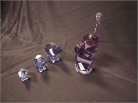 Four Alexandrite glass figures: family of three