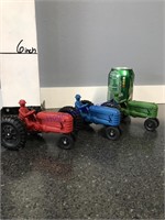 3 plastic tractors